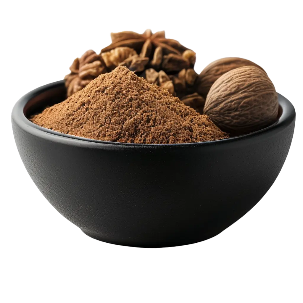 Schwarze Schale mit Muskatnuss und Gewürzen.